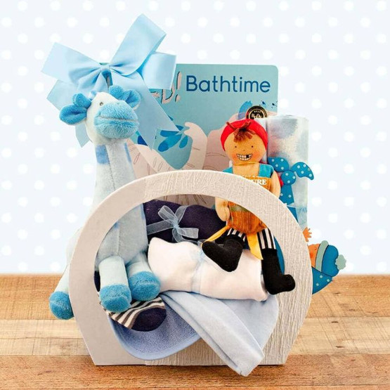 boy, duckling and blue girrafe dolls in a gift basket